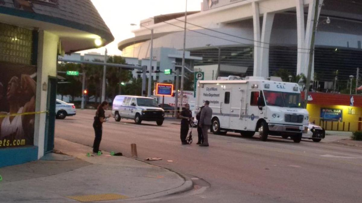 Miami police work the shooting scene at Northwest Seventh Street and 17th Court.