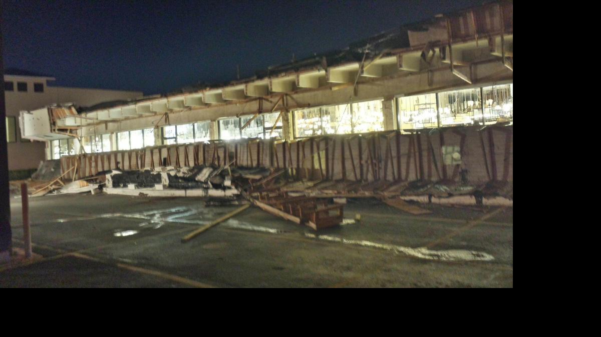 
An overhang on the outside of the Pego Lamps store in Miami fell Friday night, May 1, 2015. No one was hurt, and officials do not know what caused the collapse.
