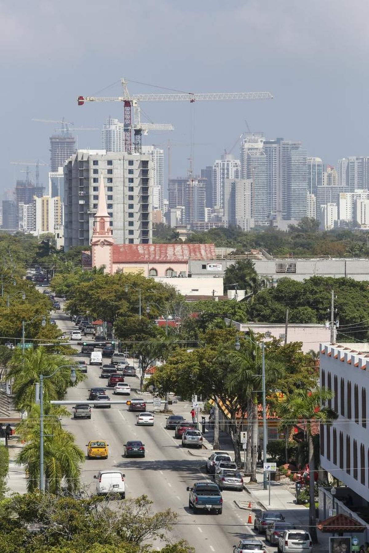 Cars in Little Havana drive on Calle Ocho toward downtown Miami on April 1, 2016.