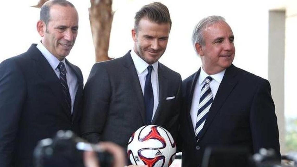 David Beckham, center, with Major League Soccer Commissioner Don Garber, left, and Miami-Dade Mayor Carlos Gimenez at February 2014 media event when Beckham was pursuing a waterfront stadium in downtown Miami. That effort failed, and now the soccer star wants to negotiate with Miami to build one next to Marlins Park in Little Havana.