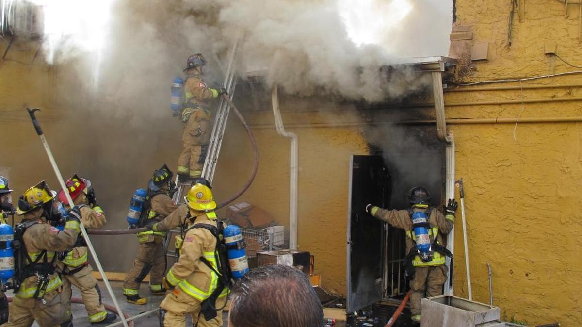 Miami firefighters put out a blaze Sunday morning at a costume shop in Little Havana.