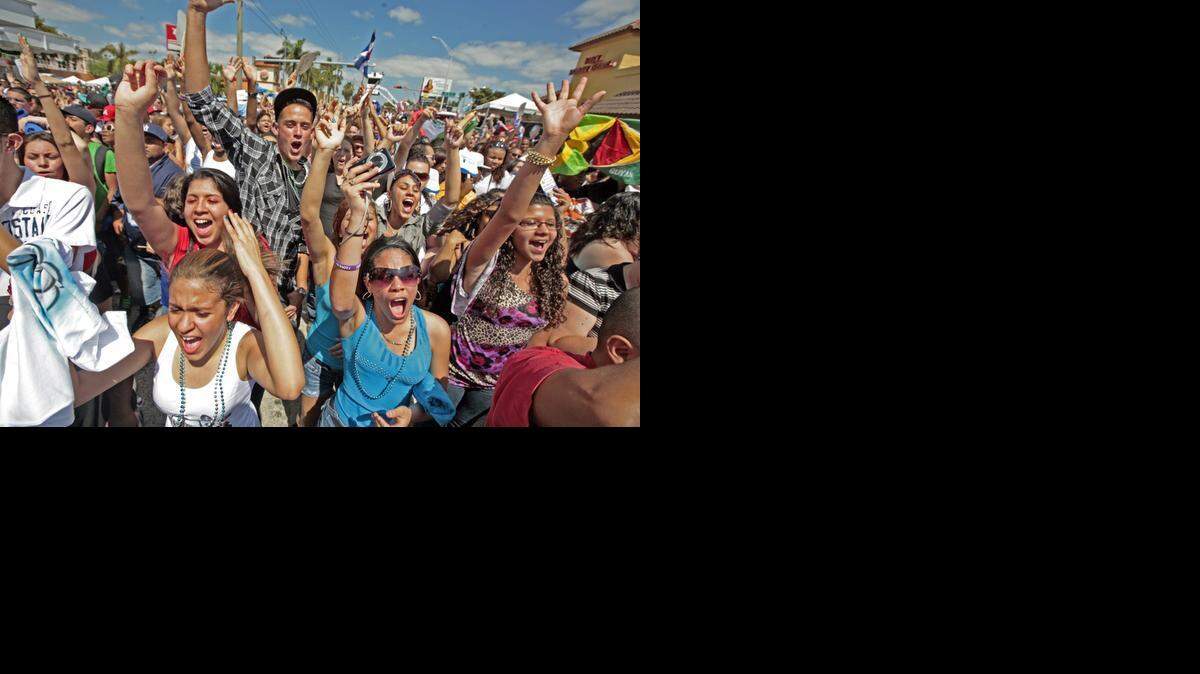 
Shanelle Calderon and Carmen Mendez dance at the Calle Ocho Street Festival in a past year.
