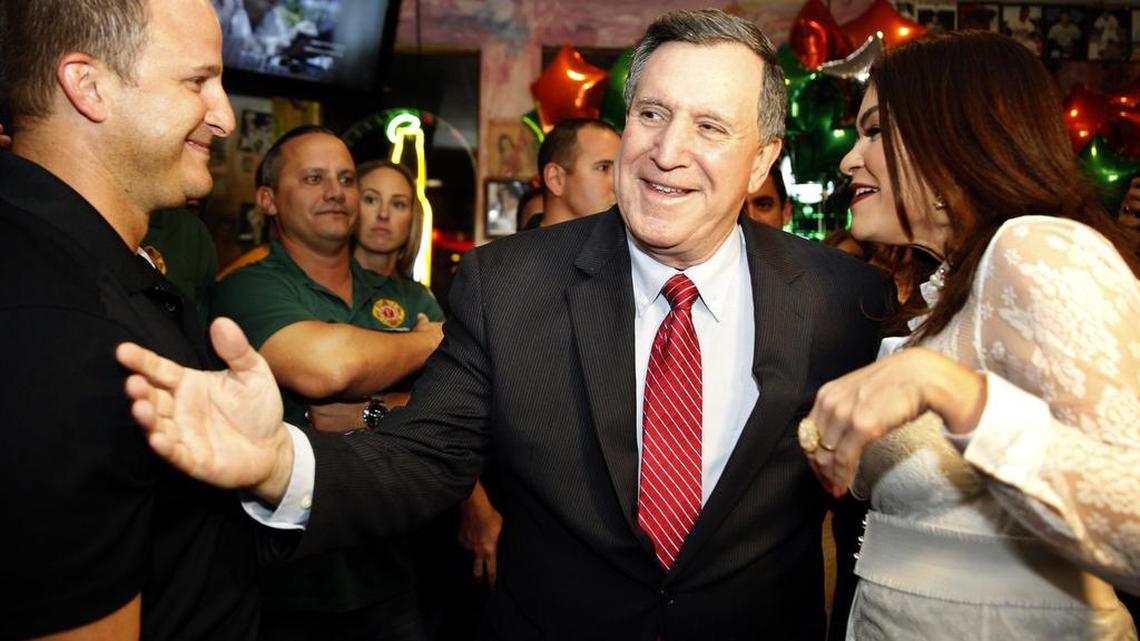 Former mayor Joe Carollo is welcomed by supporters after defeating Alfie Leon in a runoff election for Miami's city commission District 3 seat, during his watch party at El Pub restaurant in Little Havana on Tuesday, Nov. 21, 2017.