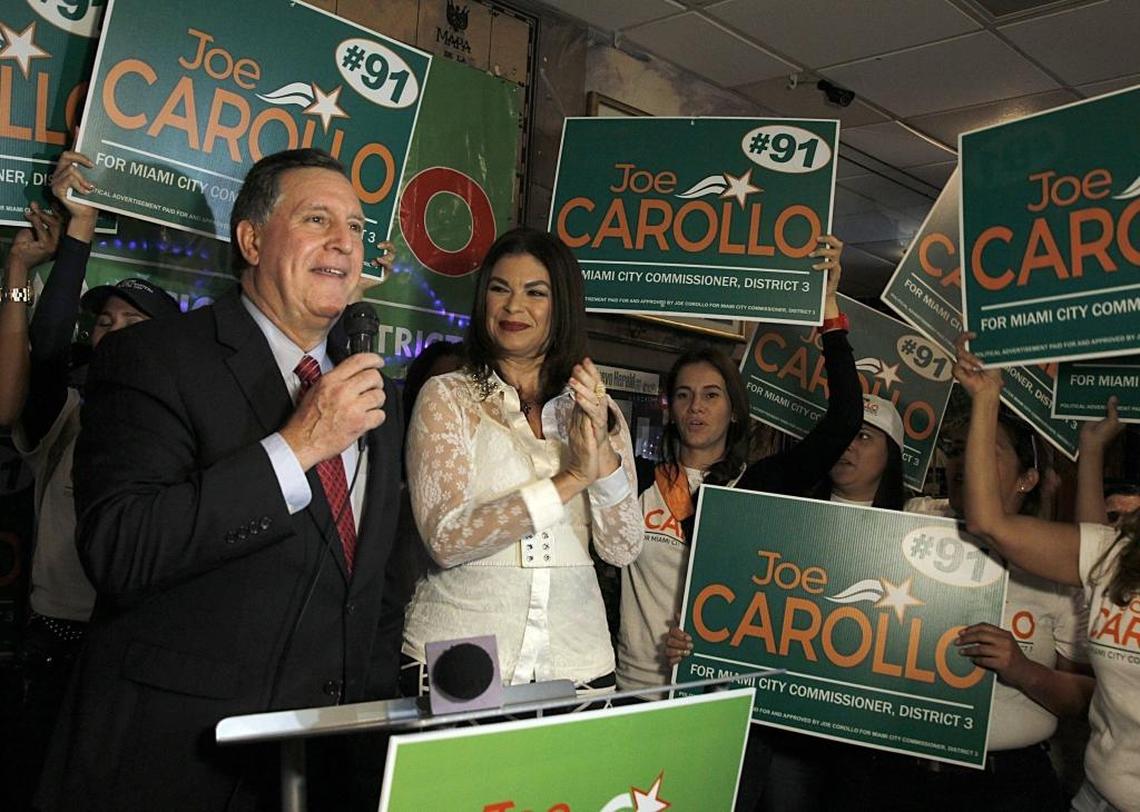 Former mayor Joe Carollo, with his wife Marjorie Farias, addresses supporters at El Pub in Little Havana after defeating Alfie Leon, in the runoff election for the District 3 seat on the Miami City Commission on Tuesday, Nov. 21, 2017.
