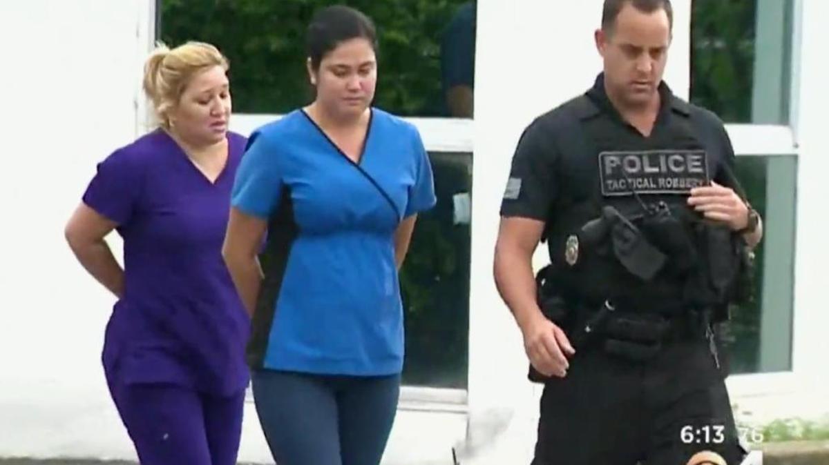 Therapist Clara R. Segura and front desk receptionist Arlene Hernandez Garcia are taken into custody Monday by Miami Police Department’s Staged Accident Detail at Brothers Medical Center, 3990 W. Flagler St., Suite 201, in Flagami.