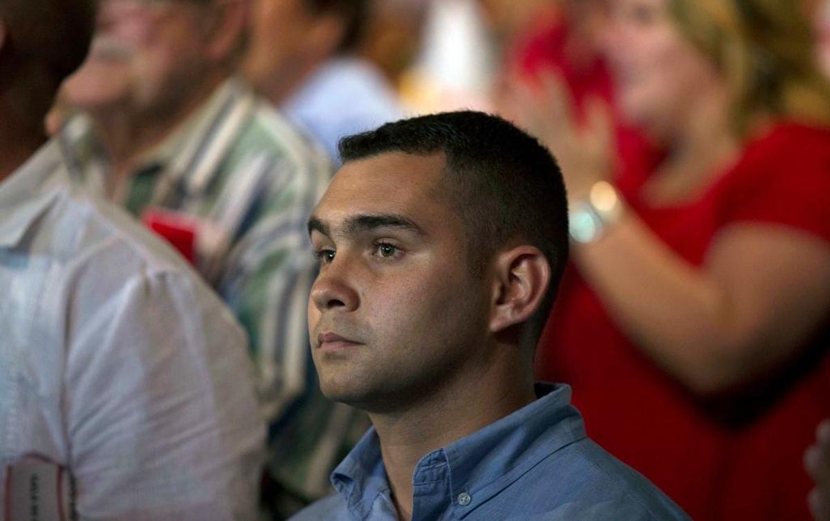 Elián González, the young Cuban rafter who was at the center of a bitter custody battle in 2000 between relatives in Miami and his father in Cuba, attends a gala for the 90th birthday of Cuban Leader Fidel Castro at the ‘Karl Marx’ theater in Havana, Cuba, Saturday, Aug. 13, 2016. (Ismael Francisco, Cubadebate via AP)
