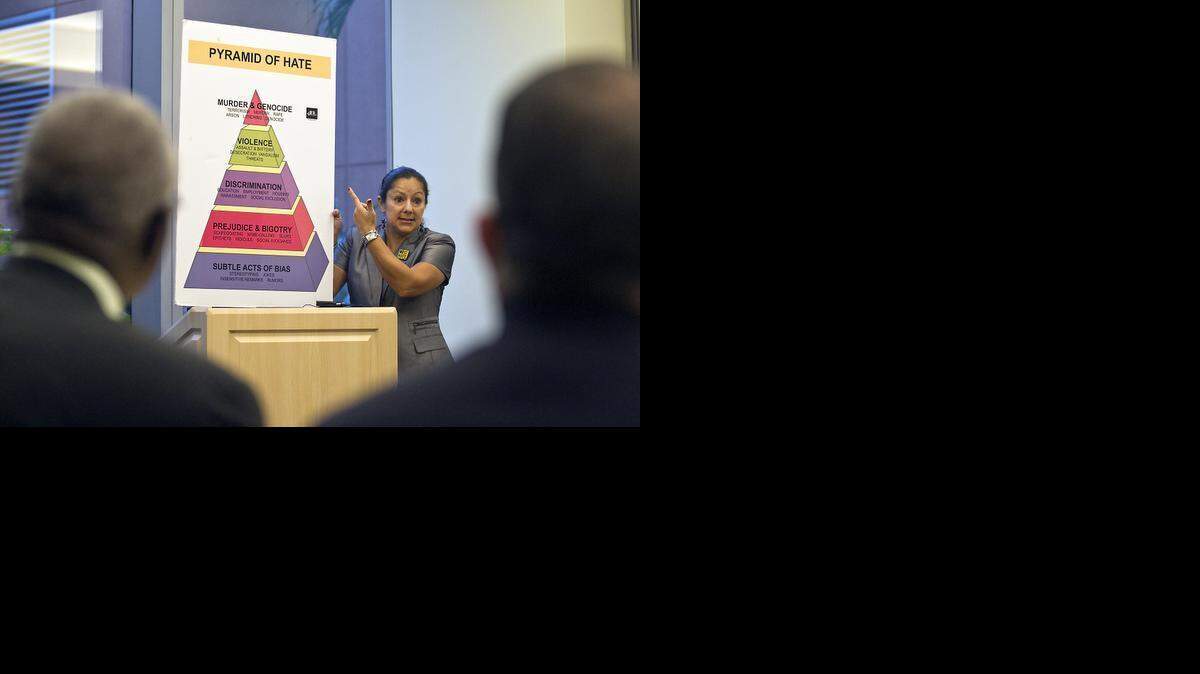 
Lily Medina of the Anti-Defamation League brings her concerns to the Miami-Dade Community Relations Board during a forum Wednesday, Feb. 4, 2015 at the University of Miami Life Science and Technology Park. The board is tasked with reducing tensions and enhancing trust between residents and police.
