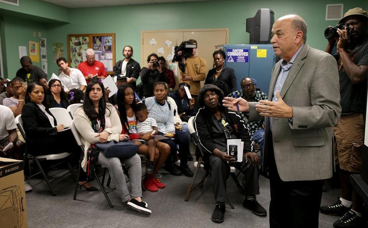 Jorge R. Cibran, a senior administrator in Miami-Dade’s housing department, assures public-housing residents that complexes near a proposed David Beckham stadium are not being considered for demolition.