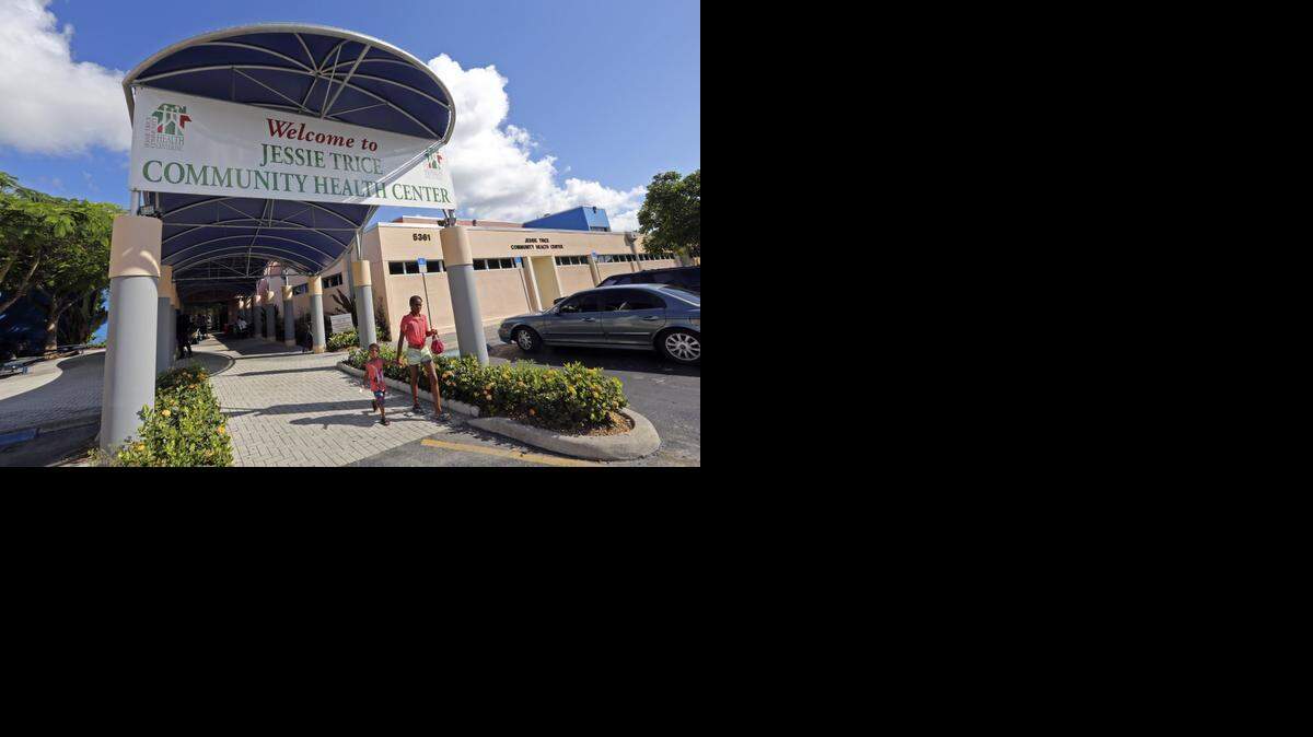 
Shadera Williams holds the hand of her 3-year-old son, Brian, as they leave the Jessie Trice Community Health Center Tuesday in Miami last year. The Jessie Trice Center was one of three community health centers in Miami — and five around the state —to receive federal grants of about $250,000 to provide mental health and substance abuse services.
