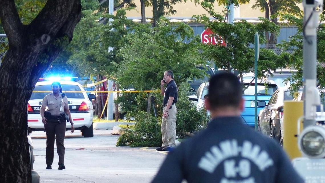 Police investigate a double shooting in a parking lot at Miami International AIrport on WEdnesday, Aug. 10, 2016.
