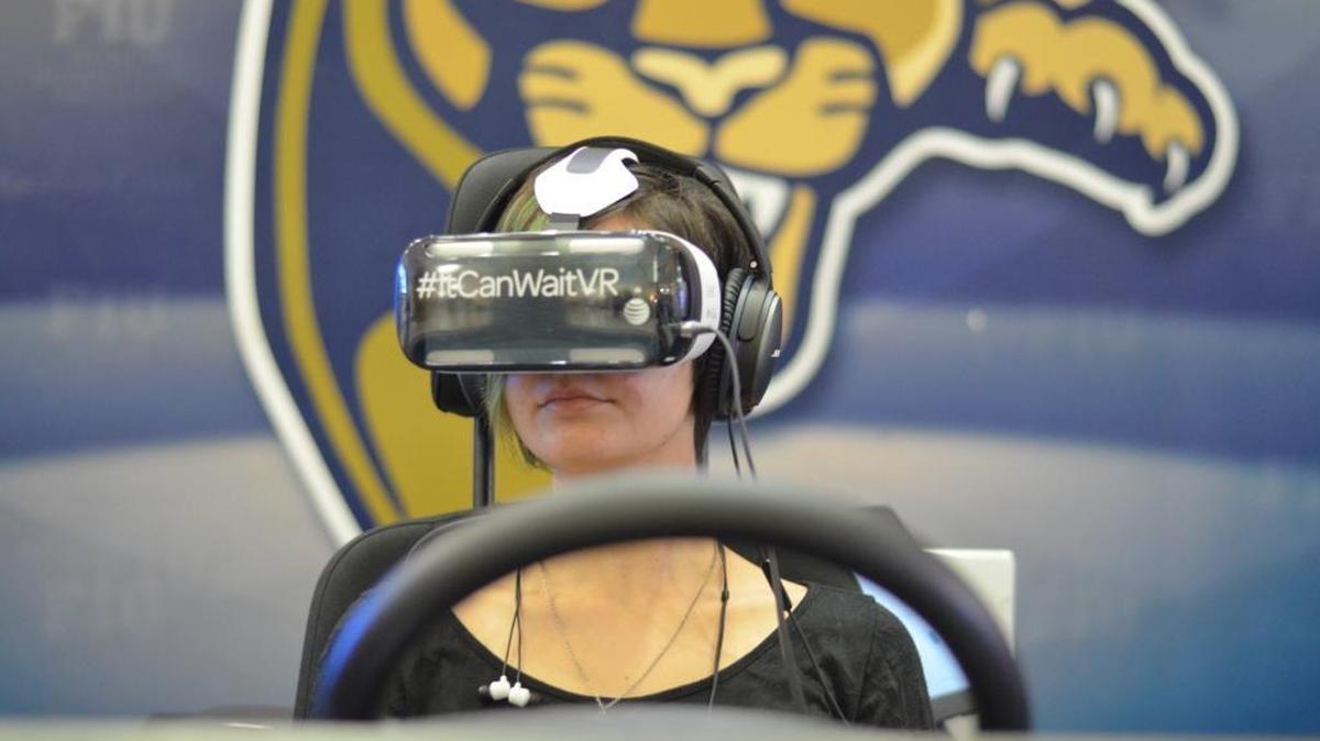 
Nicole Stone, an 18-year-old FIU English major, tries out the It Can Wait campaign’s virtual reality distracted driving experience. She said the simulation is intense.
