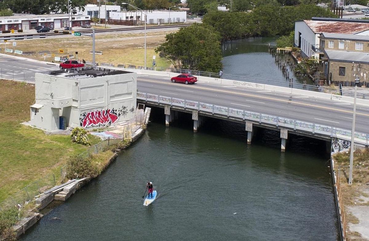 Parker Lake commutes to work on his paddleboard along Little River from his home in El Portal to one of his jobs at iPaddleMiami in Pelican Harbor Marina.