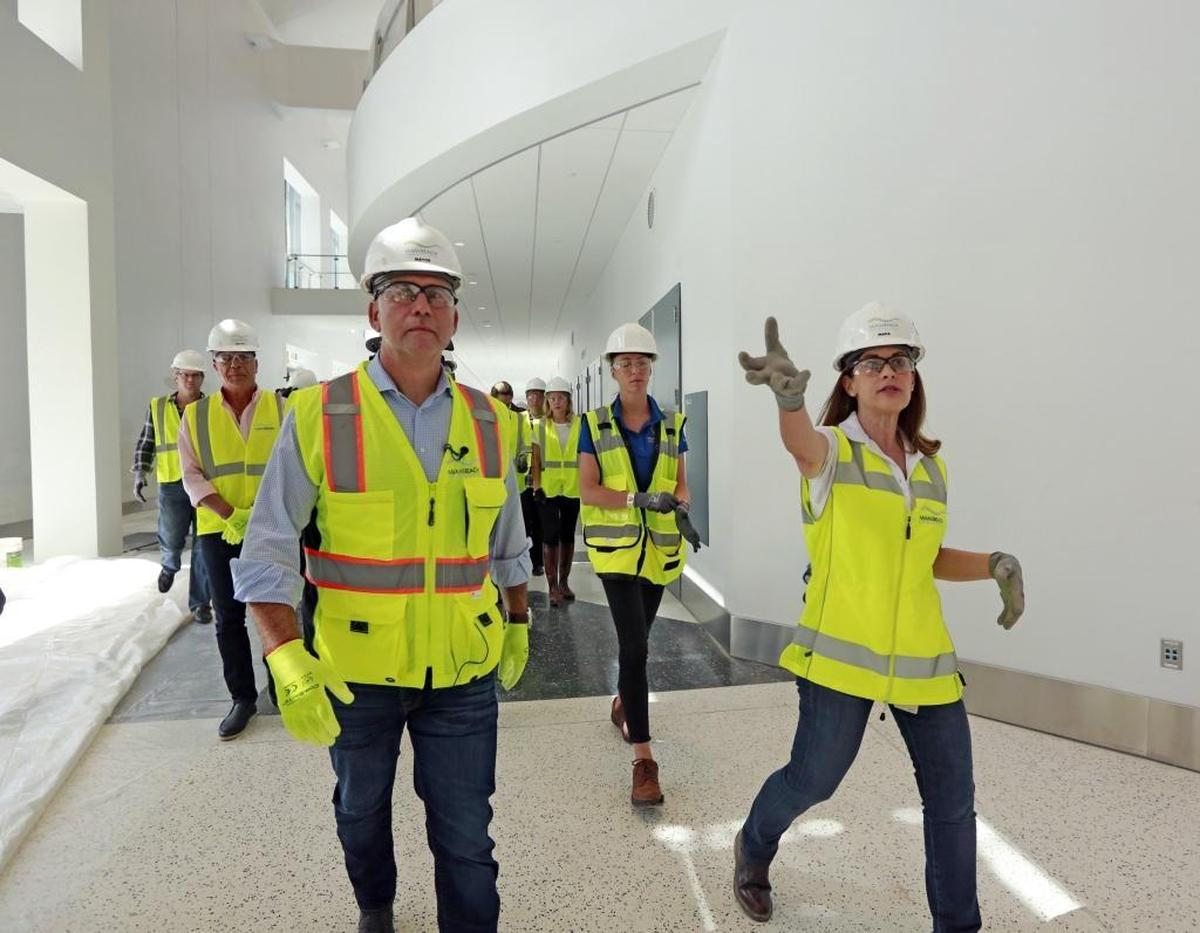 Miami Beach Mayor Philip Levine talks with Maria Hernandez, project director for the convention center district, during a tour of the under-construction Miami Beach Convention Center on Tuesday.