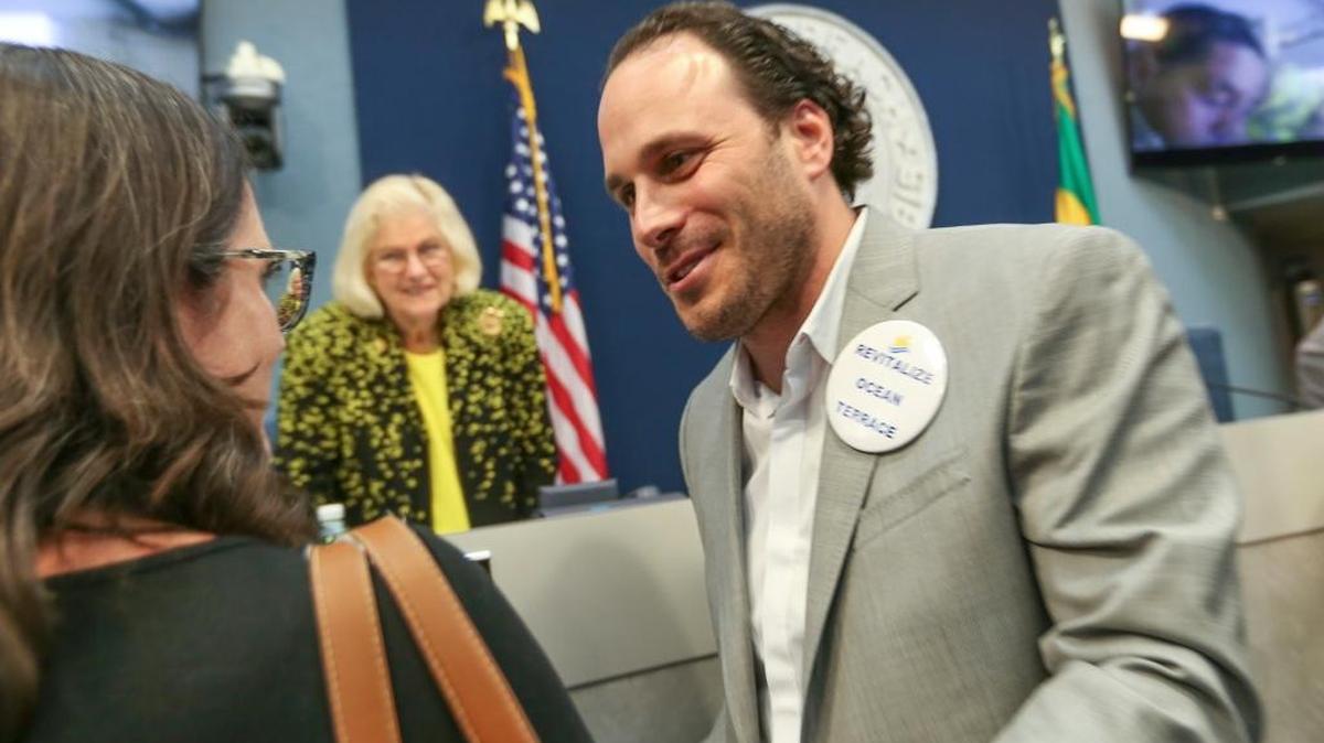 Developer Sandor Scher, right, celebrates after the City of Miami Beach on Wednesday passed a height increase which allows him to redevelop Ocean Terrace in North Beach.