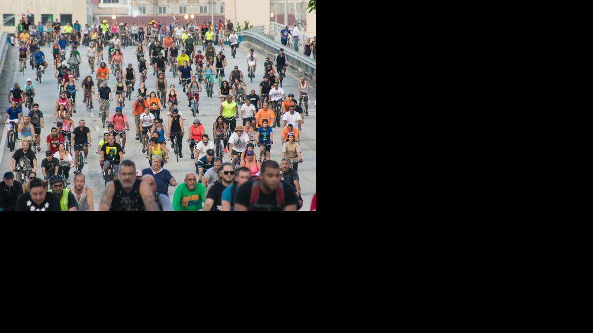 
A horde of riders crosses over the Miami River at Flagler Street during June’s Critical Mass.
