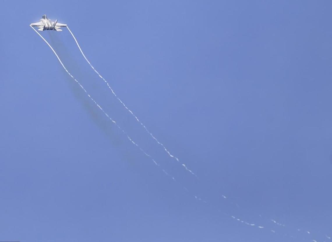 A U.S. Air Force Raptor speeds upward over Miami Beach during the air and sea show on Sunday.
