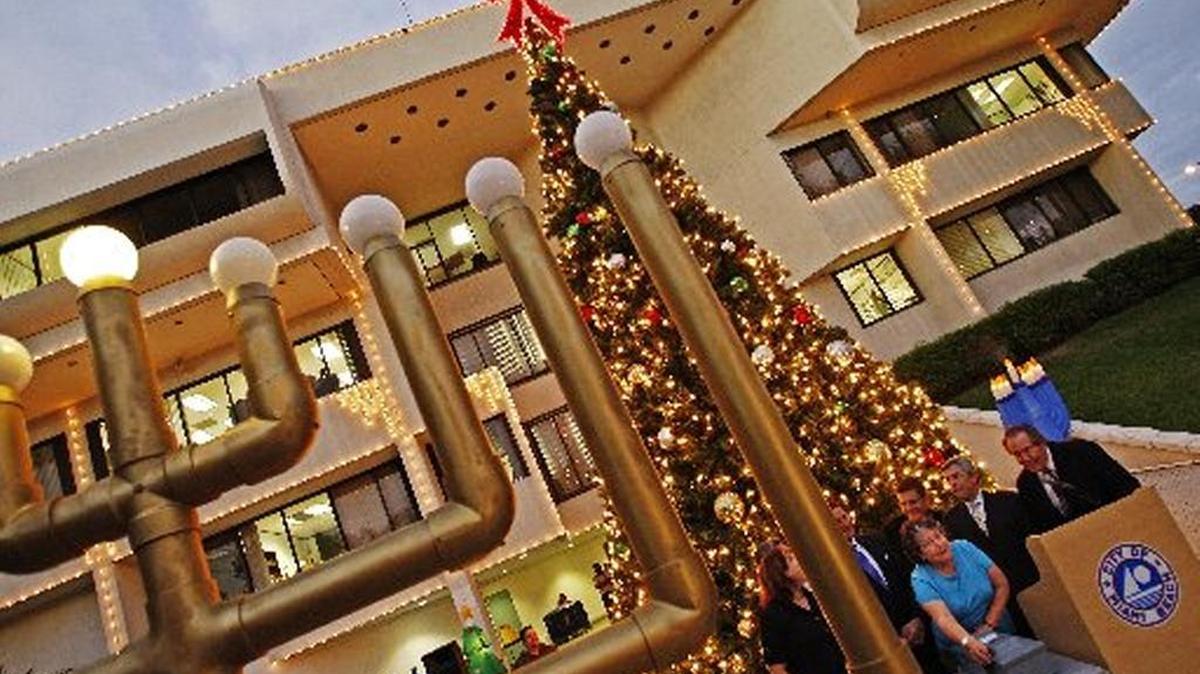 A Hanukkah menorah lights up South Beach.