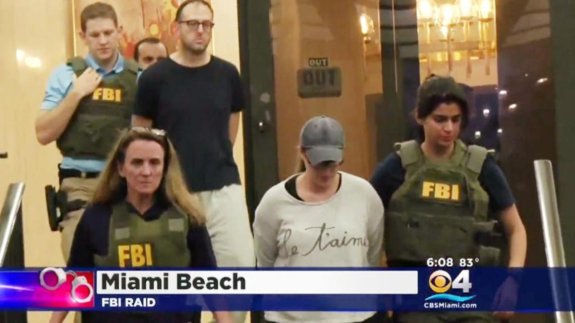 Yechezkel and Tamar Nissenbaum are led out of their Miami Beach home by FBI agents after a raid Tuesday, May 17, 2016, in Miami Beach. Federal agents say the couple liquidated a certificate of deposit worth $141,000 in 2010, and then filed Chapter 7 bankruptcy the following year, without disclosing to the Miami bankruptcy court the liquidation.