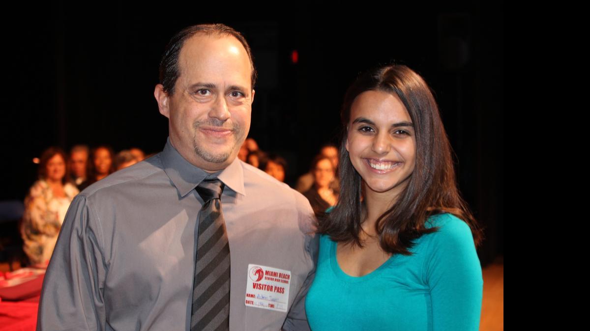 
Miami Beach High graduating senior Mary Figueroa with late singer Carole Taran’s son, Adam Taran.
