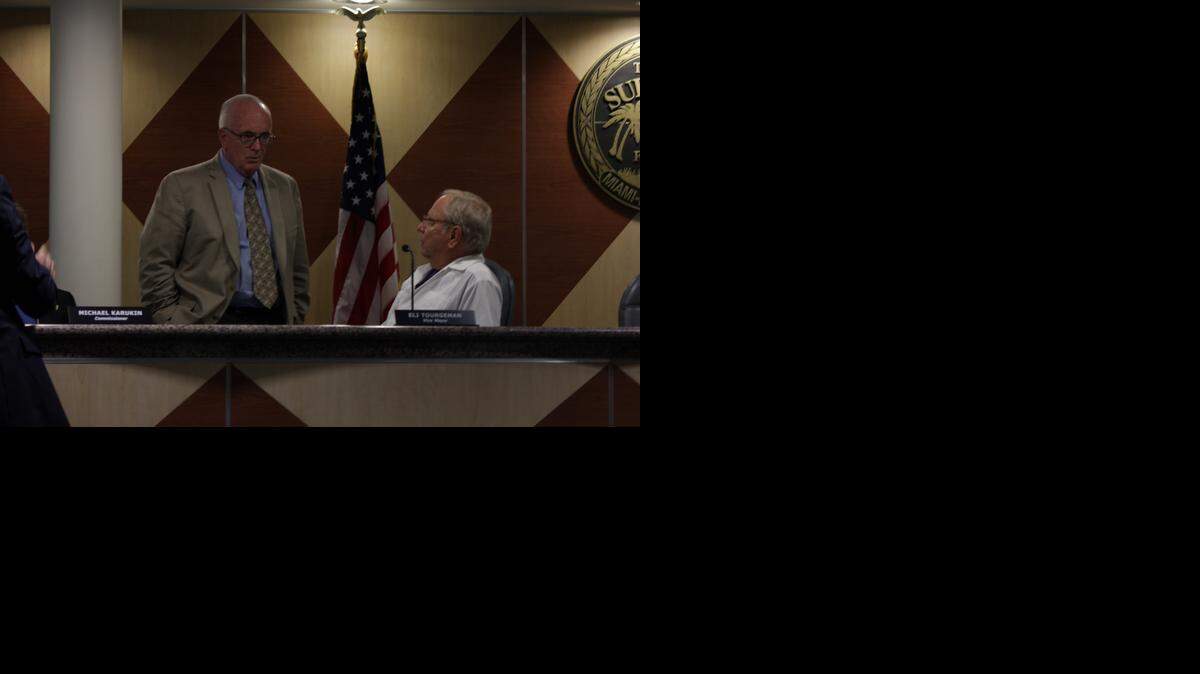 
Surfside town manager Michael Crotty and Vice-Mayor Eli Tourgeman before a town meeting on Sept. 23 at the commission chambers.
