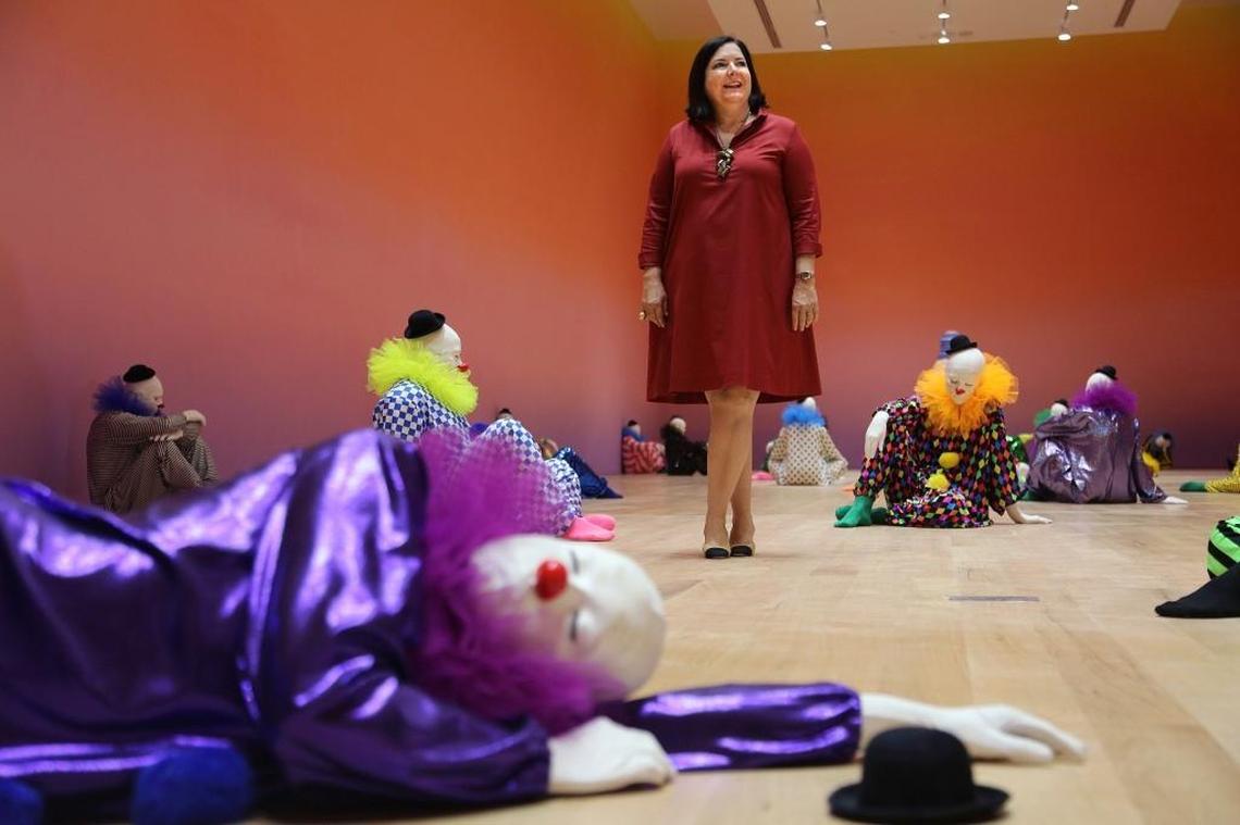 Bass museum executive director Silvia Karman Cubina stands inside the exhibition "good evening beautiful blue," by Ugo Rondinone. The Bass museum of contemporary art in Miami Beach is reopening Sunday after 2 1/2 years of renovation and expansion.