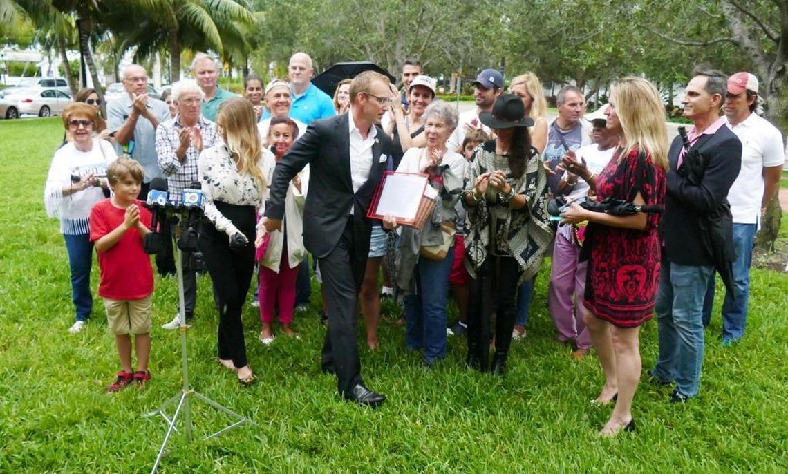 Supporters of Miami Beach Commissioner Michael Grieco clap as he finishes a press conference and leaves without taking any questions Monday, July 31, 2017. Grieco announced that he is dropping his bid for mayor. Instead, he will seek to return to his current commission seat.