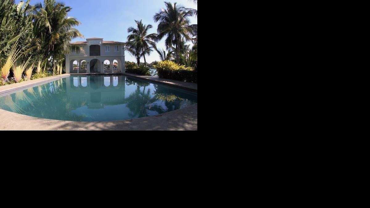 
A view from the pool to the gardens of the remodeled Al Capone mansion on Palm Island in Miami Beach, March 18, 2015. The home has been restored for video and photo shoots.

