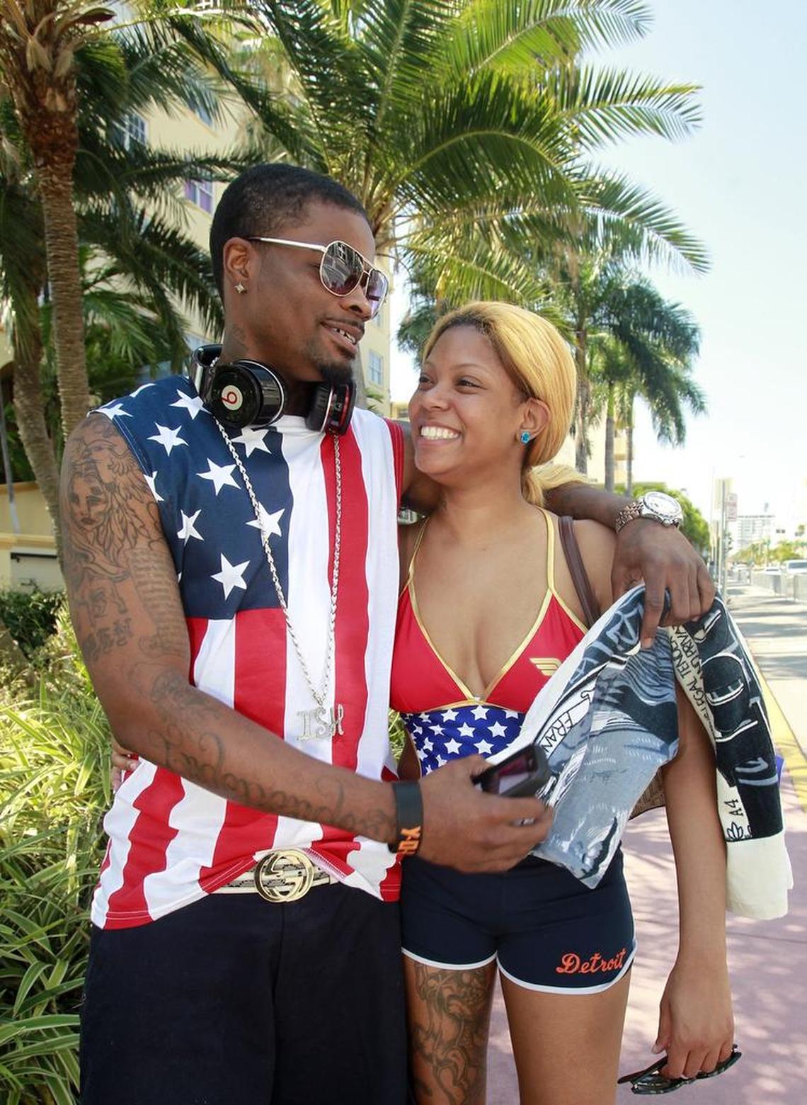 Atlanta, Georgia vacationers Glen Winbush and Aminia Cole cozy up at a South Beach crosswalk on their way to the beach during Memorial Day weekend in 2013. Miami Beach is trying to reshape the holiday weekend with city-sponsored events.