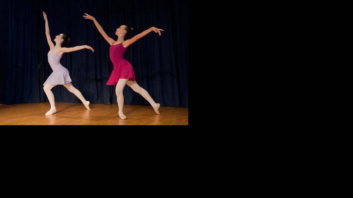
In 2012: Monica Delgado, left, and Sophia Corugedo, both with the Thomas Armour Youth Ballet, dance to music by the Greater Miami Youth Symphony during a free concert at the North Shore Park and Youth Center.
