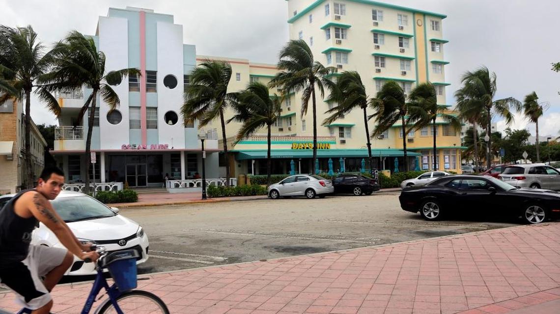 A man bikes toward the Ocean Surf and Days Inn at Miami Beach's Ocean Terrace on Oct. 23, 2015.
