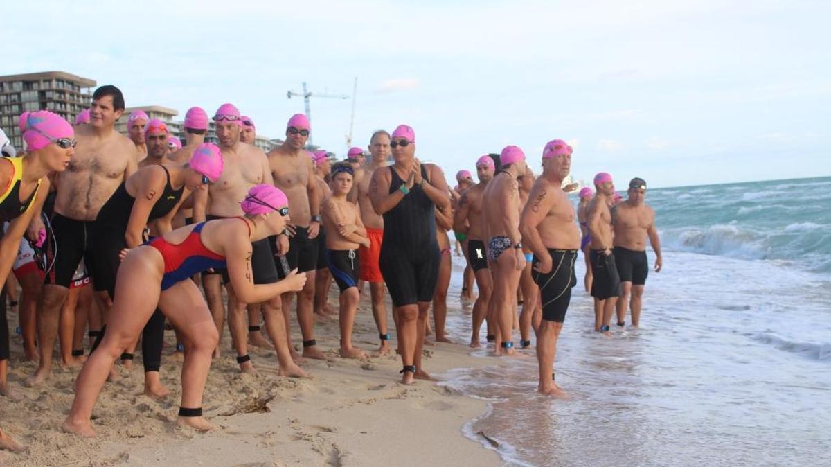 Swimmers get ready to rush the North Beach water at Swim Miami Beach on Saturday, Oct. 17.