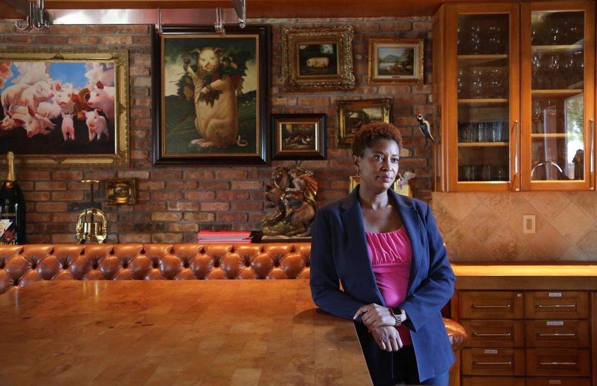 Attorney Latasha G. Hines is overseeing the auction of items inside the two Star Island mansions that used to belong to Thomas Kramer.
