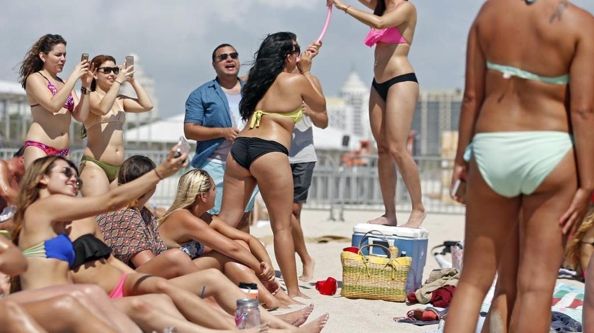 Spring breakers gather on South Beach in March 2015.