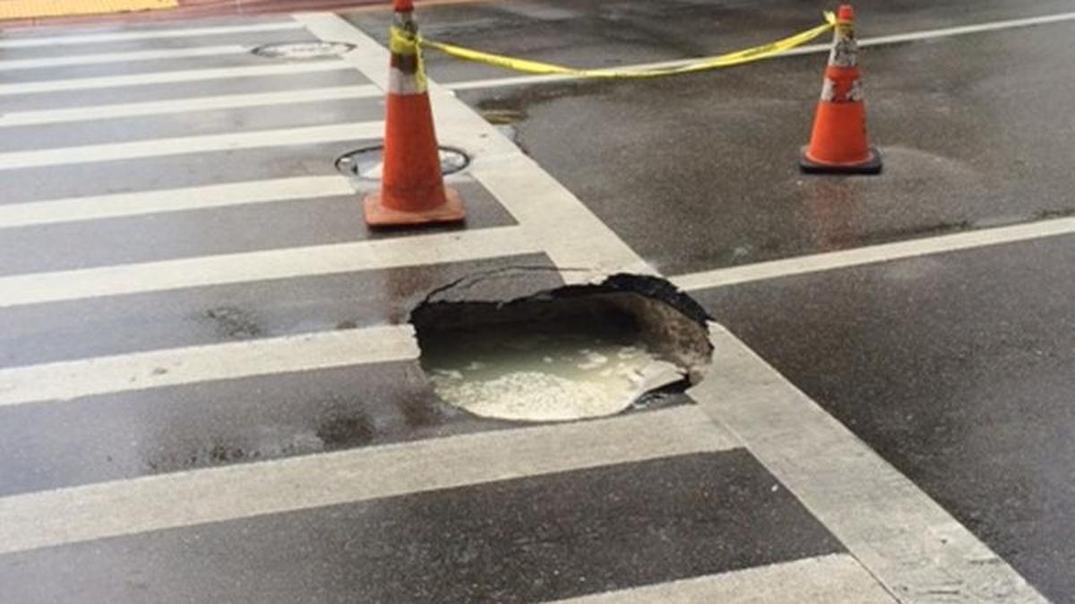 
A three-foot pothole opened up in the middle of the road around 43rd Street just below the Fontainebleau Miami Beach hotel.
