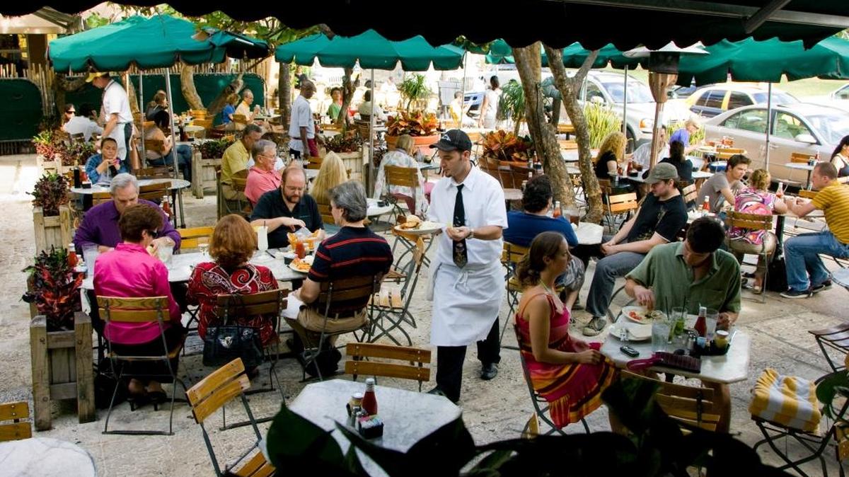 Folks eat outside at the News Cafe, 800 Ocean Drive, Miami Beach.