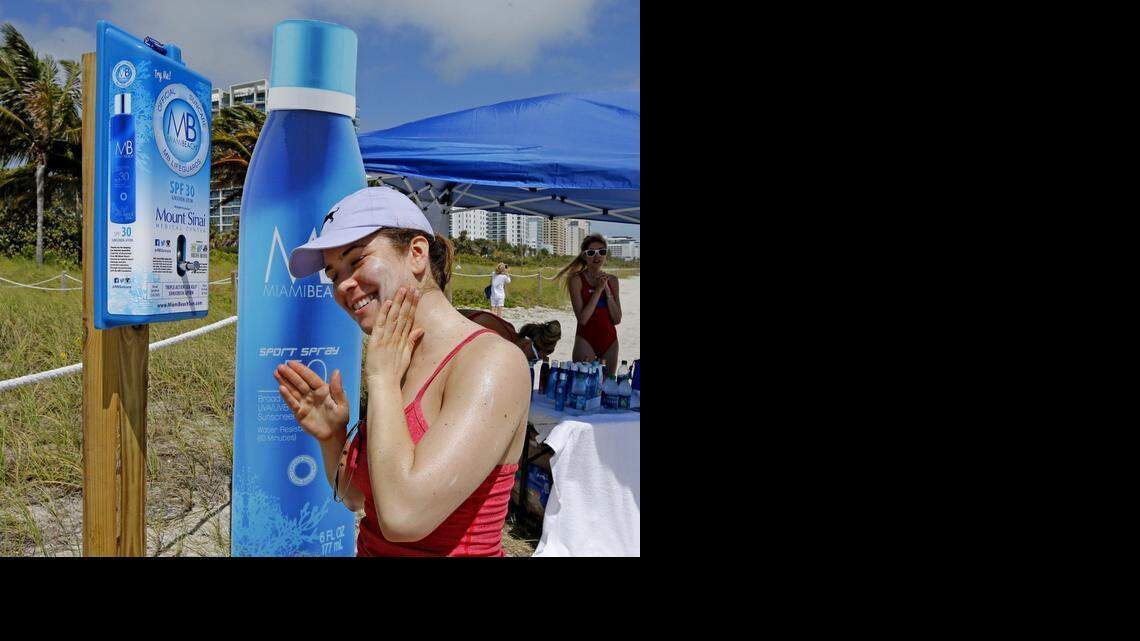 
Rachel Gerber, of New York City, applies sunscreen from a dispenser at 21st Street on Miami Beach, Friday, March 13, 2015. The City of Miami Beach is installing 50 sunscreen dispensers throughout the city for public use. The sunscreen dispensers will be placed at public pools, parks and various beach access points near lifeguard stands for all who visit Miami Beach to use, free of charge. And of course, the sunscreen being provided in the dispensers is none other than MB Miami Beach Triple Action Sea Kelp Sunscreen Lotion.

