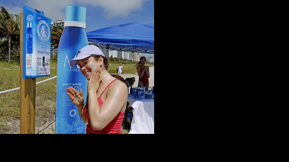 
Rachel Gerber, of New York City, applies sunscreen from a dispenser at 21st Street on Miami Beach, Friday, March 13, 2015. The City of Miami Beach is installing 50 sunscreen dispensers throughout the city for public use. The sunscreen dispensers will be placed at public pools, parks and various beach access points near lifeguard stands for all who visit Miami Beach to use, free of charge. And of course, the sunscreen being provided in the dispensers is none other than MB Miami Beach Triple Action Sea Kelp Sunscreen Lotion.
