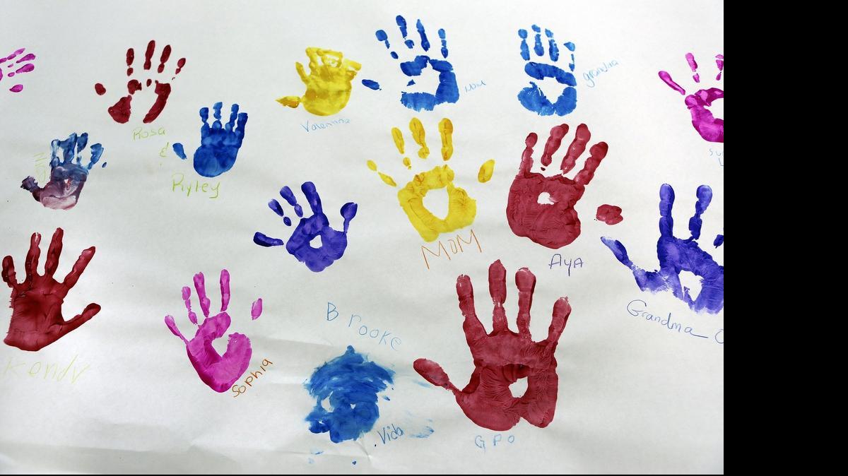 Colorful handprints are part of a Rainbow Mural made by visitors to the Miami Children’s Museum celebrating Pride Month.