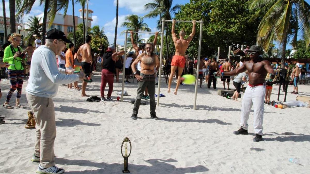 Sal Capozucca, 96, of Miami Beach, tests his speed and agility with YouTube star ‘Big Tony’ during the Barstarzz fifth annual Pull Up Jam on South Beach. Capozucca, a retired beer vendor, received a trophy that read ‘most inspirational.’