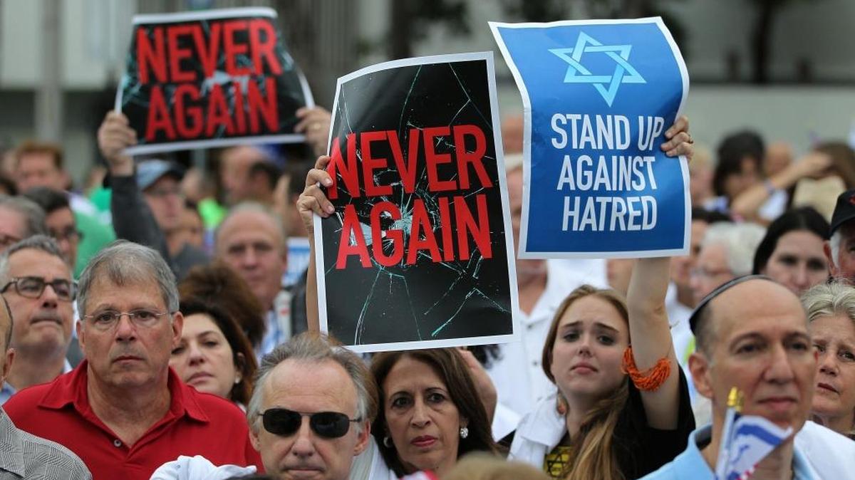 People gather for the ‘Never Again’ rally, an event held to call attention to anti-Semitic incidents across the world on Sunday, Nov. 15, 2015 at the Holocaust Memorial in Miami Beach.