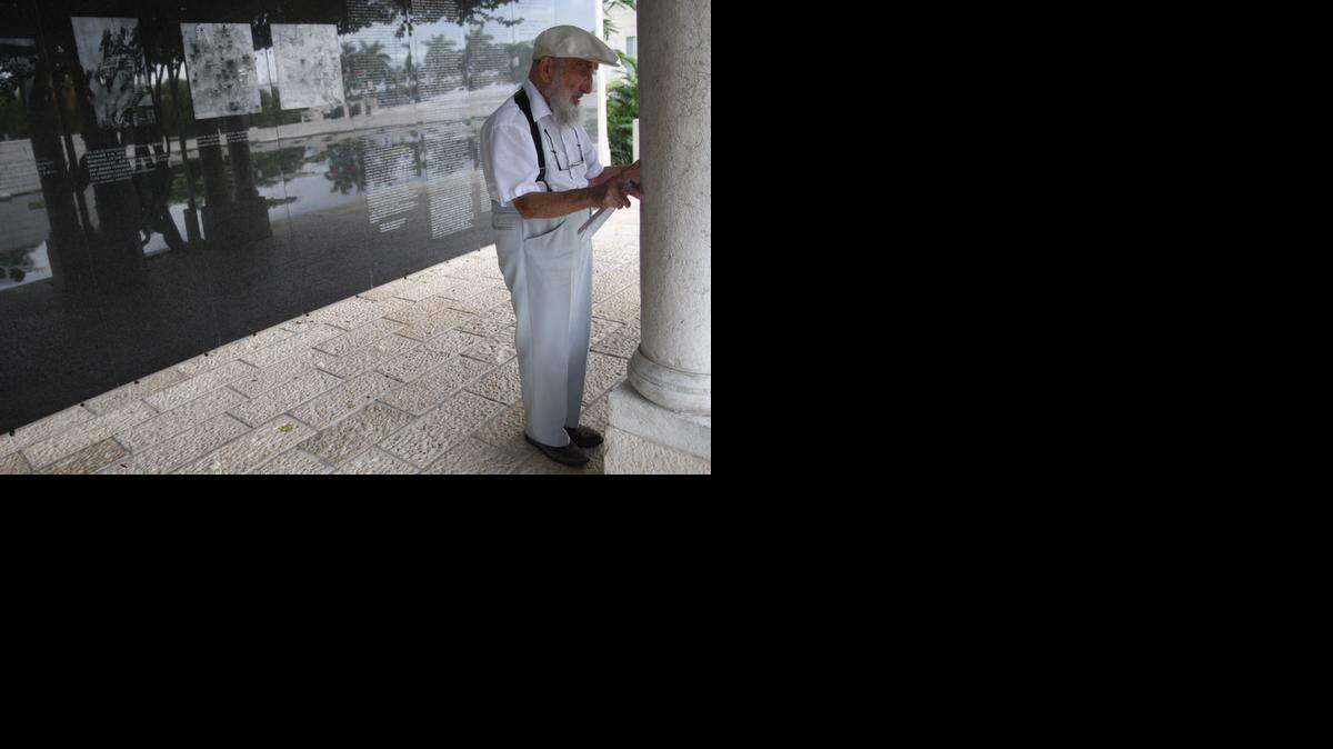 
Henry Shapiro, 98, prays for his 16 Polish relatives who perished during the Holocaust at the Holocaust Memorial in Miami Beach on Sunday, April 12, 2015.
