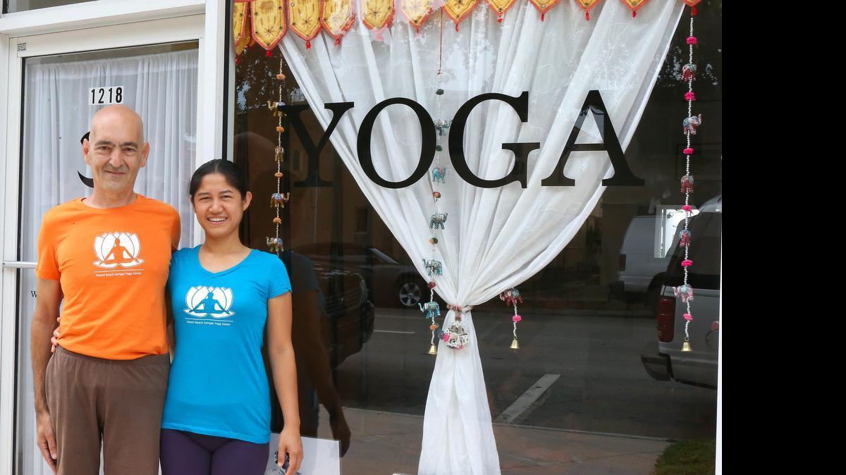
“I feel comfortable and proud of our lifestyle. Gradually, we’ve been able to grow up to the point where we are today,” says Pom with her husband Enrique Cayeiro at their Iyengar Yoga Center on Miami Beach. They are among small business owners benefitting from an overall improvement in South Florida’s economy.
