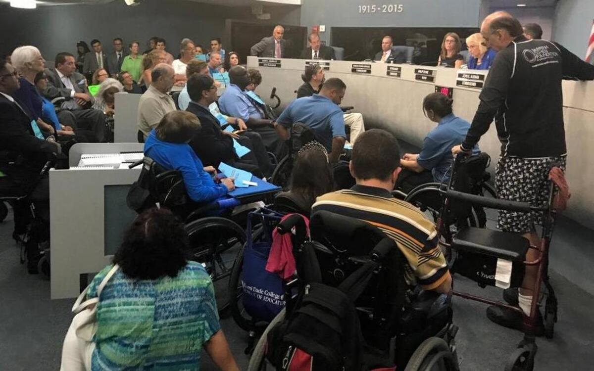 Supporters and opponents of a planned beachside facility for people with disabilities filled the Miami Beach commission chamber in July 2017.