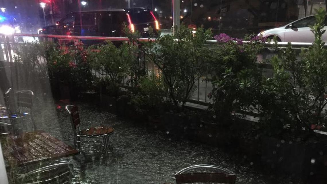 During a heavy rainstorm on the night of Oct. 3, the sidewalk outside Sardinia Enoteca Ristorante in Miami Beach flooded, spilling water into the business after the city failed to turn on nearby stormwater pumps.