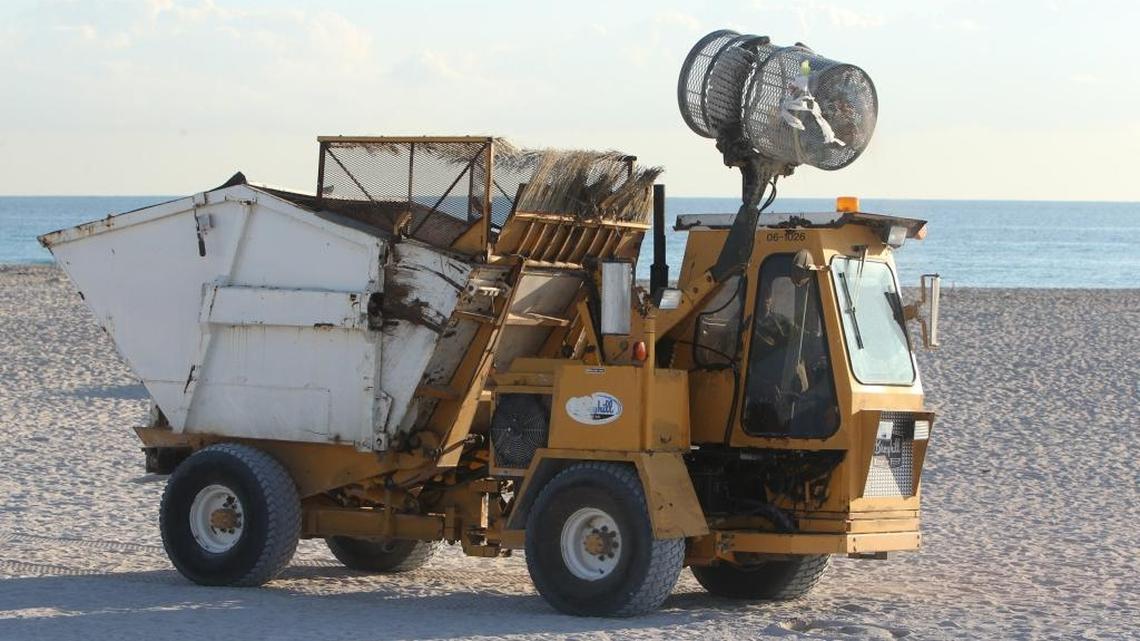 
New style garbage can used on Miami Beach demonstrated by heavy equipment operator, Ruben Arocha Friday Dec. 19, 2014.
