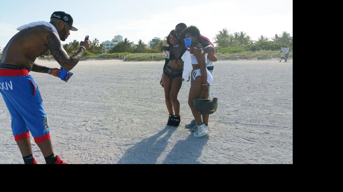 
Trillanie Brown, wearing black swimsuit, of Carol City and a friend have their picture taken on Miami Beach on Monday, May 25, 2015.

