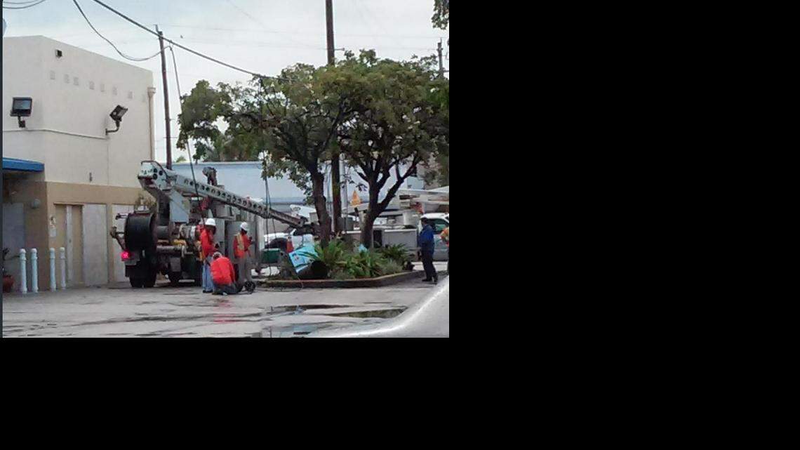 
Crews work near 71st Street and Indian Creek Drive on Miami Beach after a car hit a light pole just after midnight on New Year’s Day.
