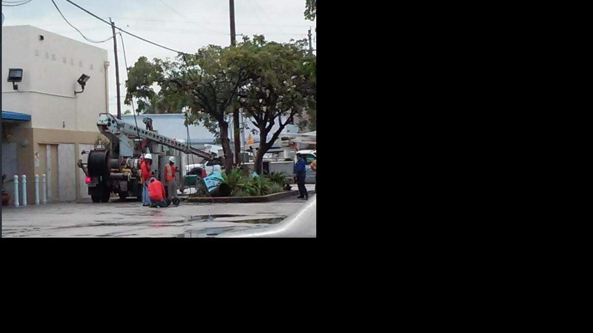 
Crews work near 71st Street and Indian Creek Drive on Miami Beach after a car hit a light pole just after midnight on New Year’s Day.
