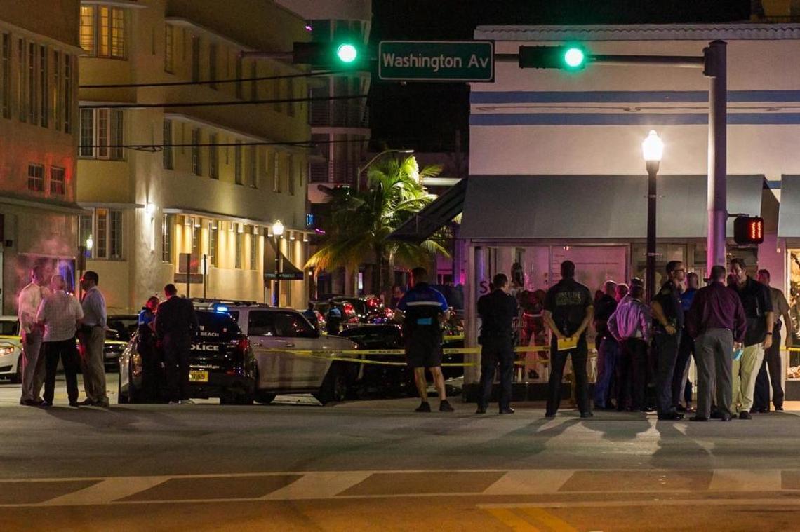 Miami Beach police investigate an incident in which a woman was shot dead after she slammed her car into an officer and then crashing into a white SUV on Washington Avenue at South Beach on Sunday, October 8, 2017.