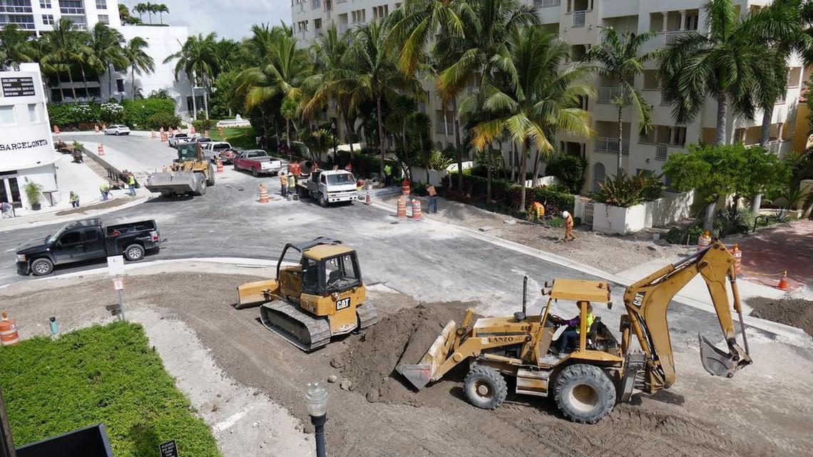 Construction workers raise the height of the street and sidewalks in front of the Publix at 1920 West Ave. in Miami Beach.